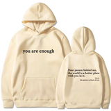 Retro pullover hoodie in cream color with inspirational text, perfect for casual streetwear style.